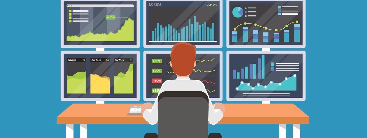 Businessman or stock market trader working at desk with six monitor showing data.